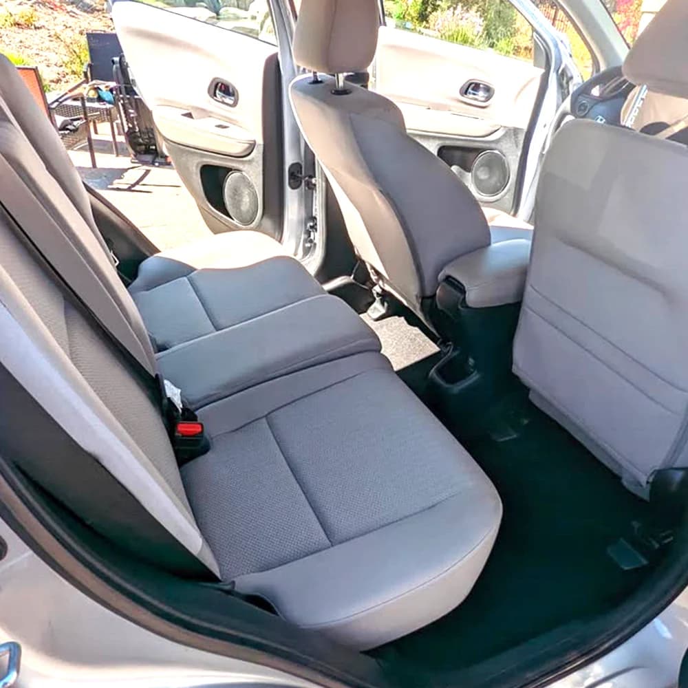 The same rear seat after an interior deep clean, stain removed and carpets extracted