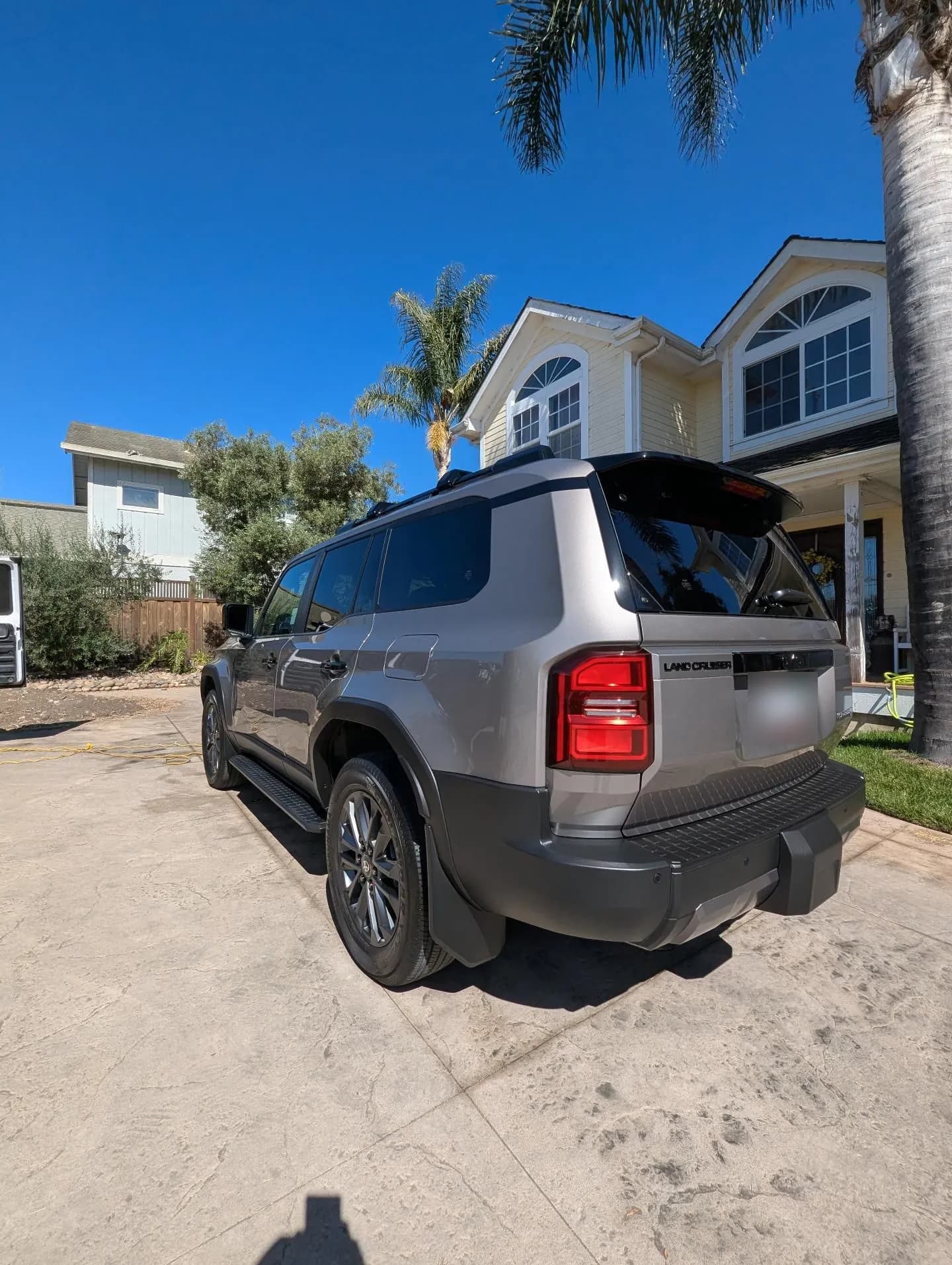 Rear of a gray Toyota Land Cruiser after a detail